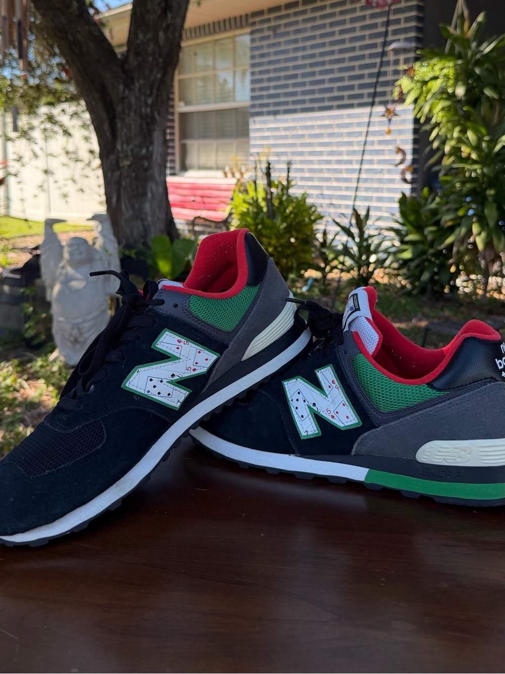 New Balance Men's Black Sneakers with Green and Red Accents
